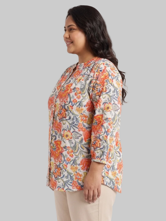 Woman wearing a floral blouse on a white background