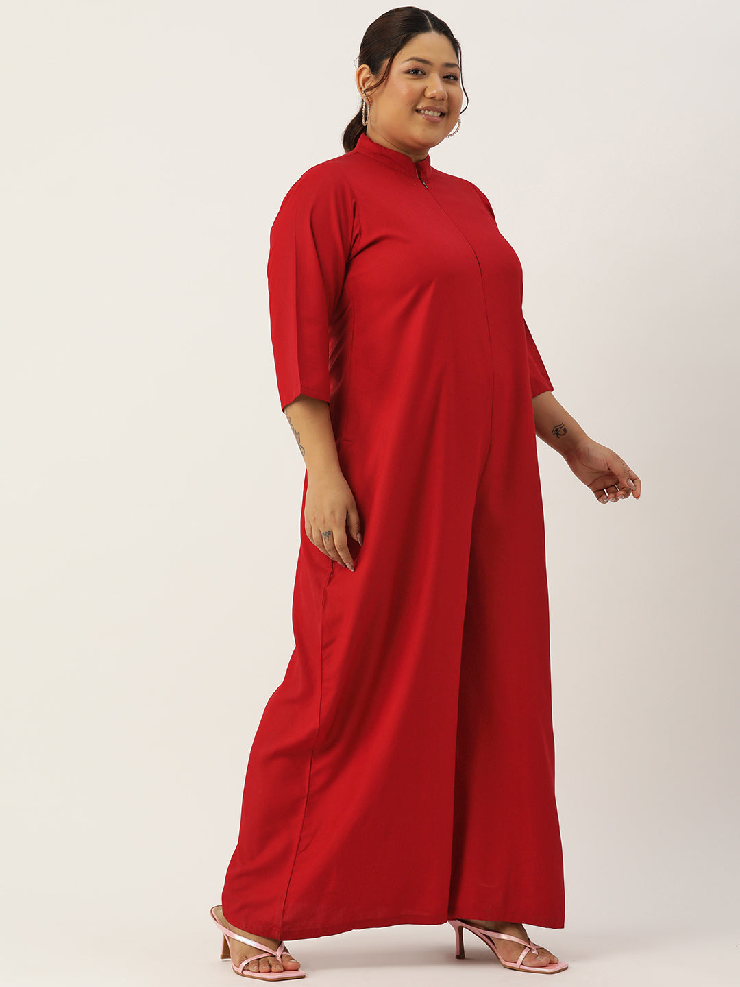 Woman wearing a red dress on a white background