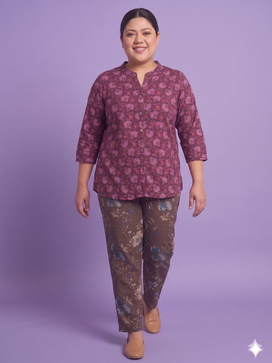 Woman wearing a patterned outfit on a purple background