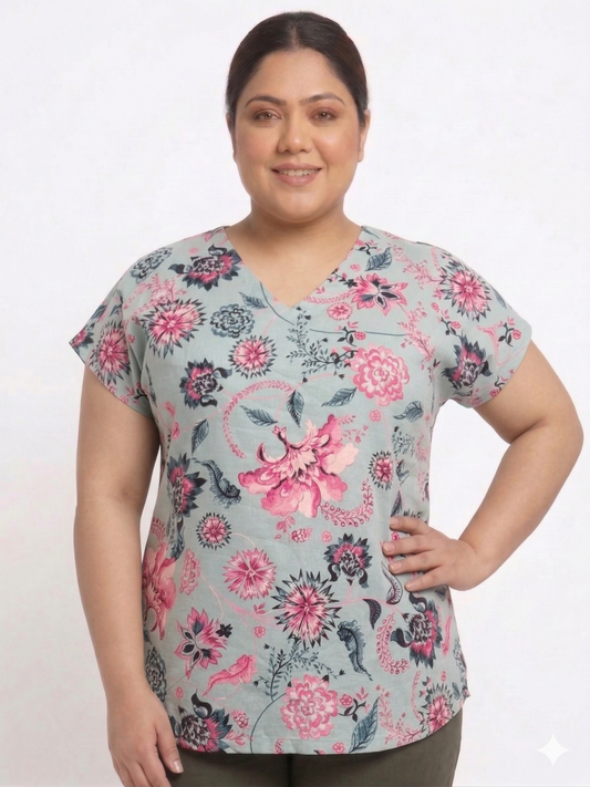 Woman wearing a floral patterned top on a white background