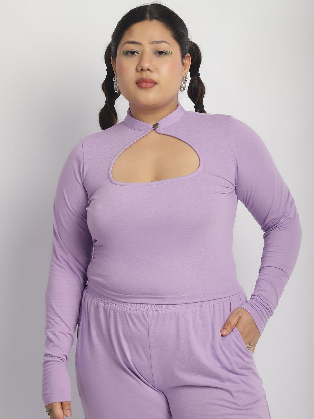 Woman wearing a purple outfit with cut-out design on a white background