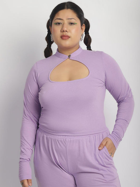Woman wearing a purple outfit with cut-out design on a white background