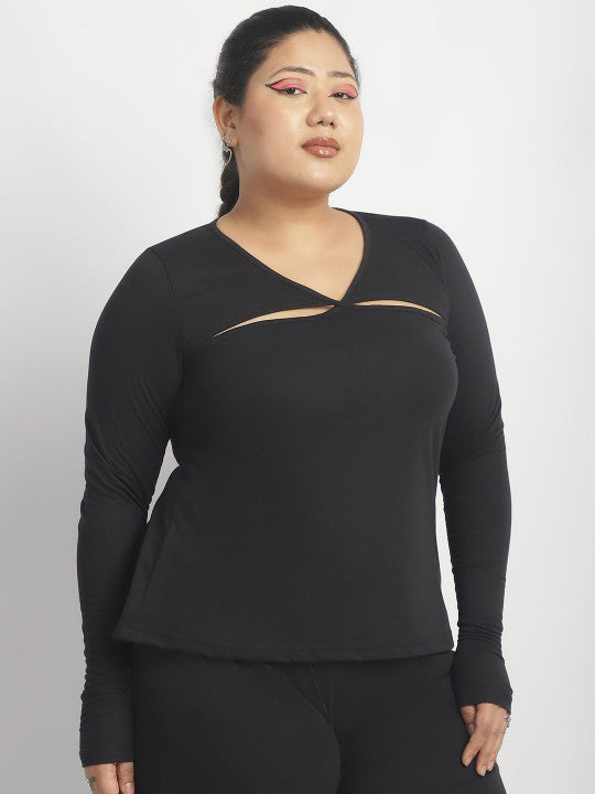 Woman wearing a black long-sleeve top with cut-out design on a white background