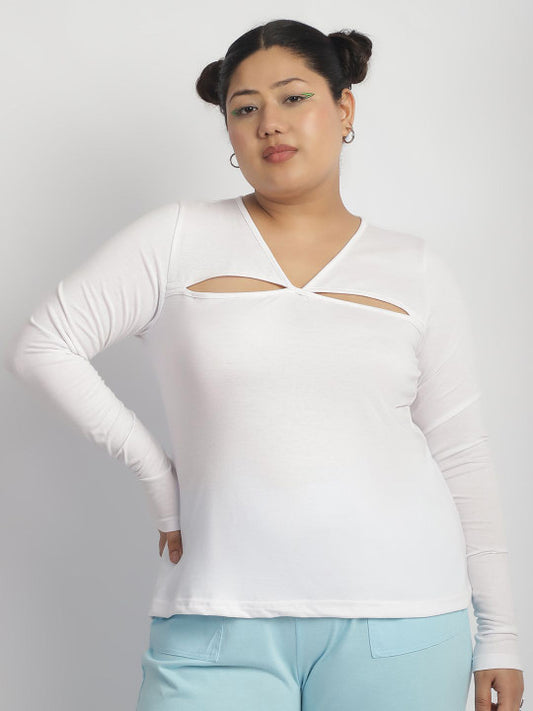 Person wearing a white long-sleeve top with cut-out design on a plain background